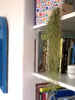 Cube air plant design holder with Tillandsia Usneoidus (Spanish Moss) on a shelf